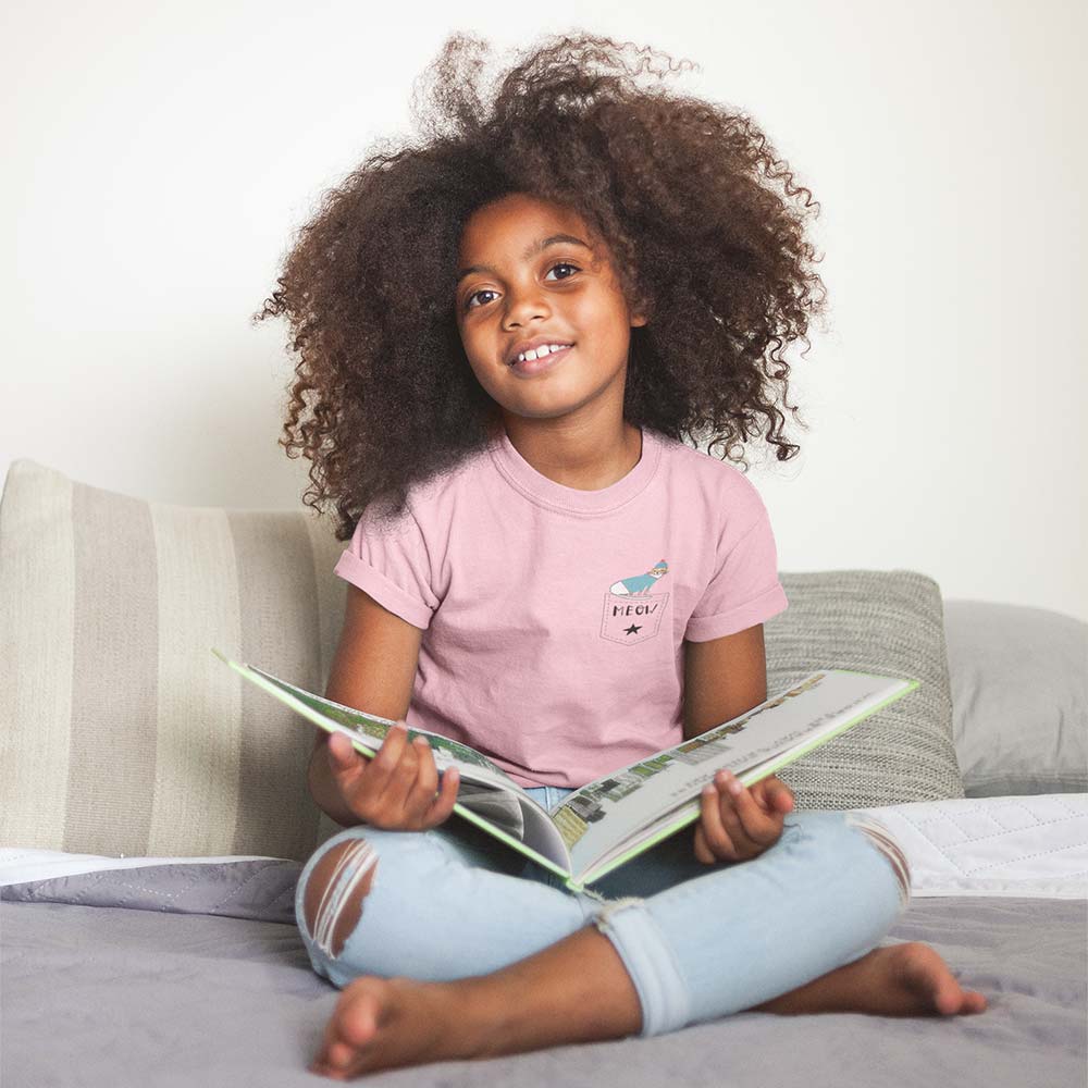 mockup-of-a-little-black-girl-wearing-a-t-shirt-while-reading mockup of a little black girl wearing a t shirt while reading a21320